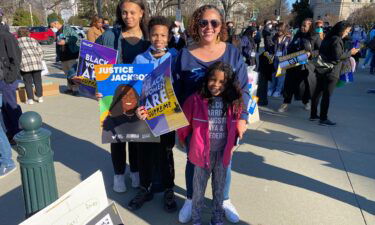 Lauryl Jackson and her children attend Black Women's Collective Rally in Washington