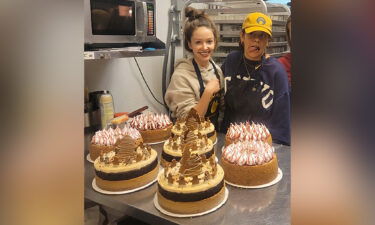 Laika Cheesecakes and Espresso business owner Anna Afanasieva with one of her team members and their cakes.
