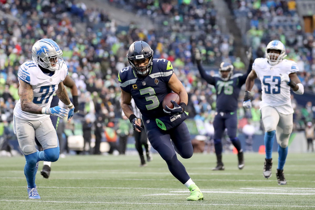 <i>Steph Chambers/Getty Images</i><br/>Russell Wilson runs the ball against the Detroit Lions during the fourth quarter of a game on January 2