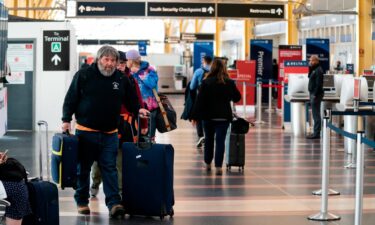 Passengers walk in the terminal at Ronald Reagan Washington National Airport