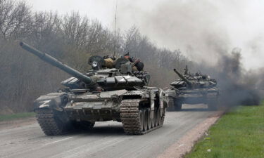 Tanks of pro-Russian troops drive along a road during Ukraine-Russia conflict near the southern port city of Mariupol