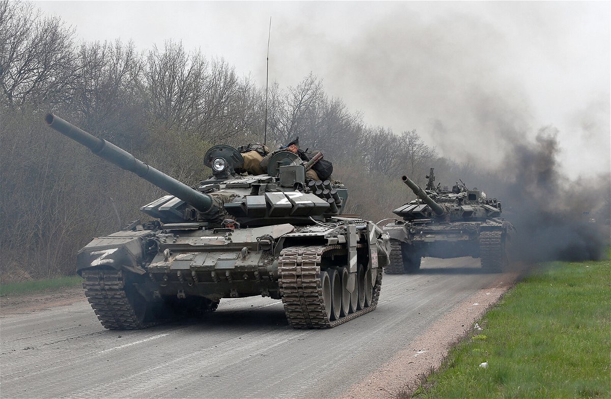<i>Alexander Ermochenko/Reuters</i><br/>Tanks of pro-Russian troops drive along a road during Ukraine-Russia conflict near the southern port city of Mariupol