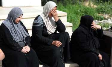 Relatives mourn during the funeral of Ghada Sbatin