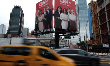 An advertisement for CNN+ is displayed in Manhattan on April 21