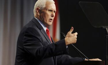Former Vice President Mike Pence speaks at the Florida chapter of the Federalist Society's annual meeting at Disney's Yacht Club resort in Walt Disney World on February 4