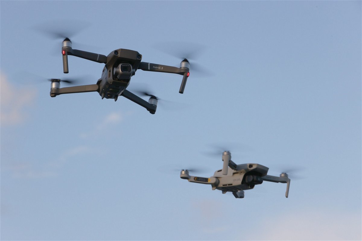 <i>Joe Raedle/Getty Images</i><br/>A DJI Mavic 2 Pro and DJi Mavic Mini made by the Chinese drone maker fly near each other on December 15