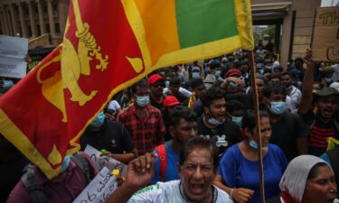 Sri Lankan people protest on April 12 in front of the Presidential Secretariat office in Galle Face