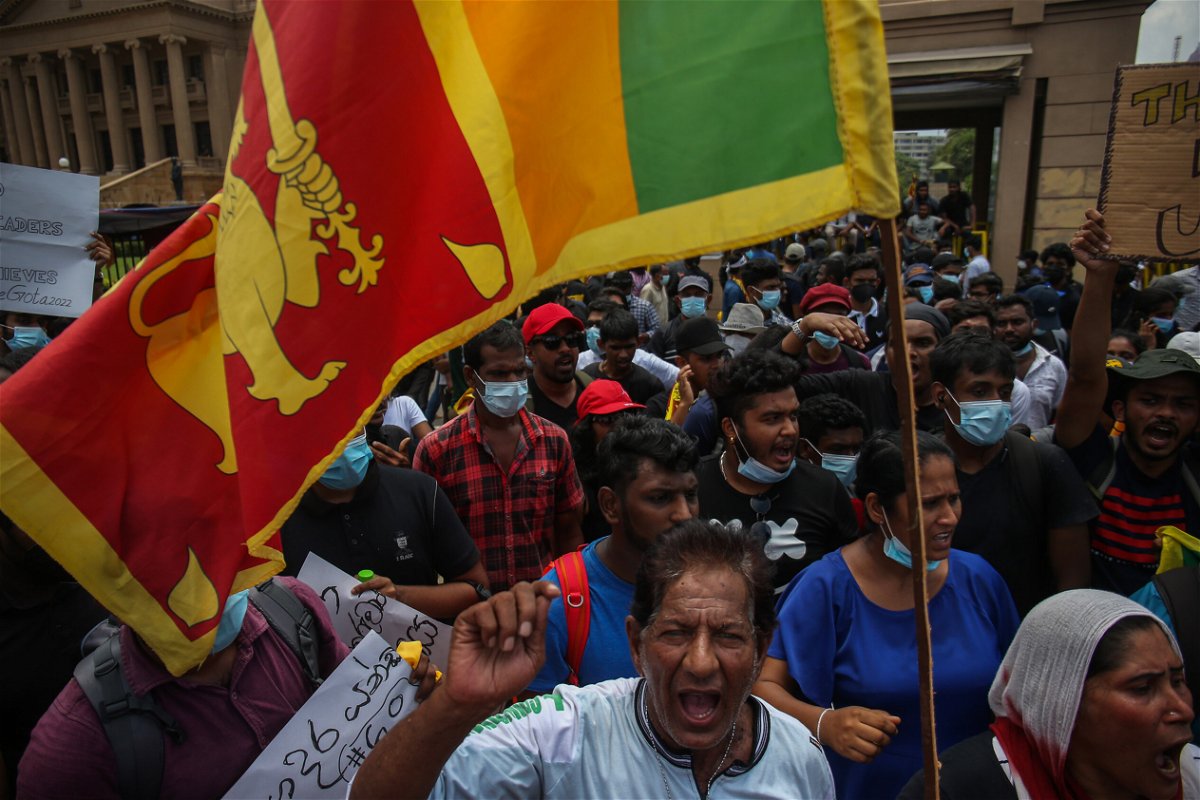 <i>NurPhoto/Getty Images</i><br/>Sri Lankan people protest on April 12 in front of the Presidential Secretariat office in Galle Face