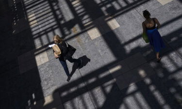 A shopper carries bags inside the Westfield Culver City shopping mall in Culver City