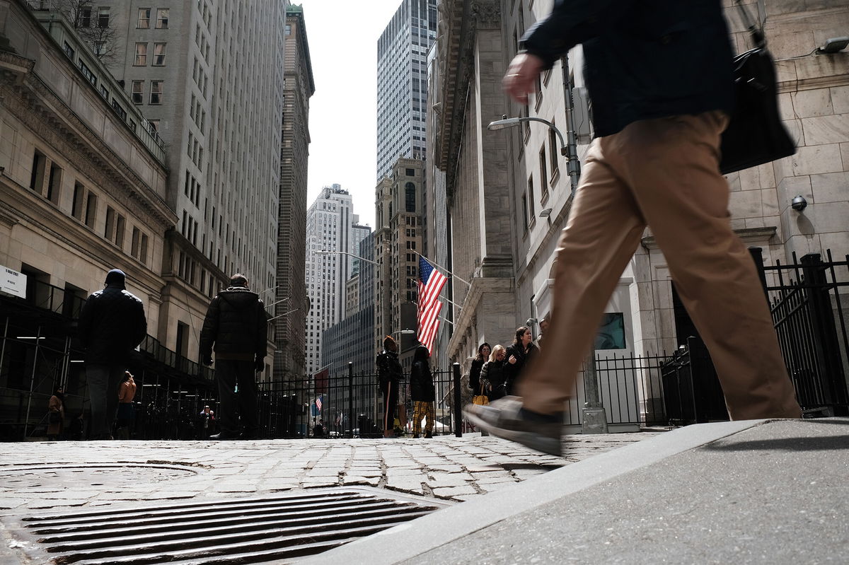 <i>Spencer Platt/Getty Images</i><br/>People walk by the New York Stock Exchange (NYSE) on April 4