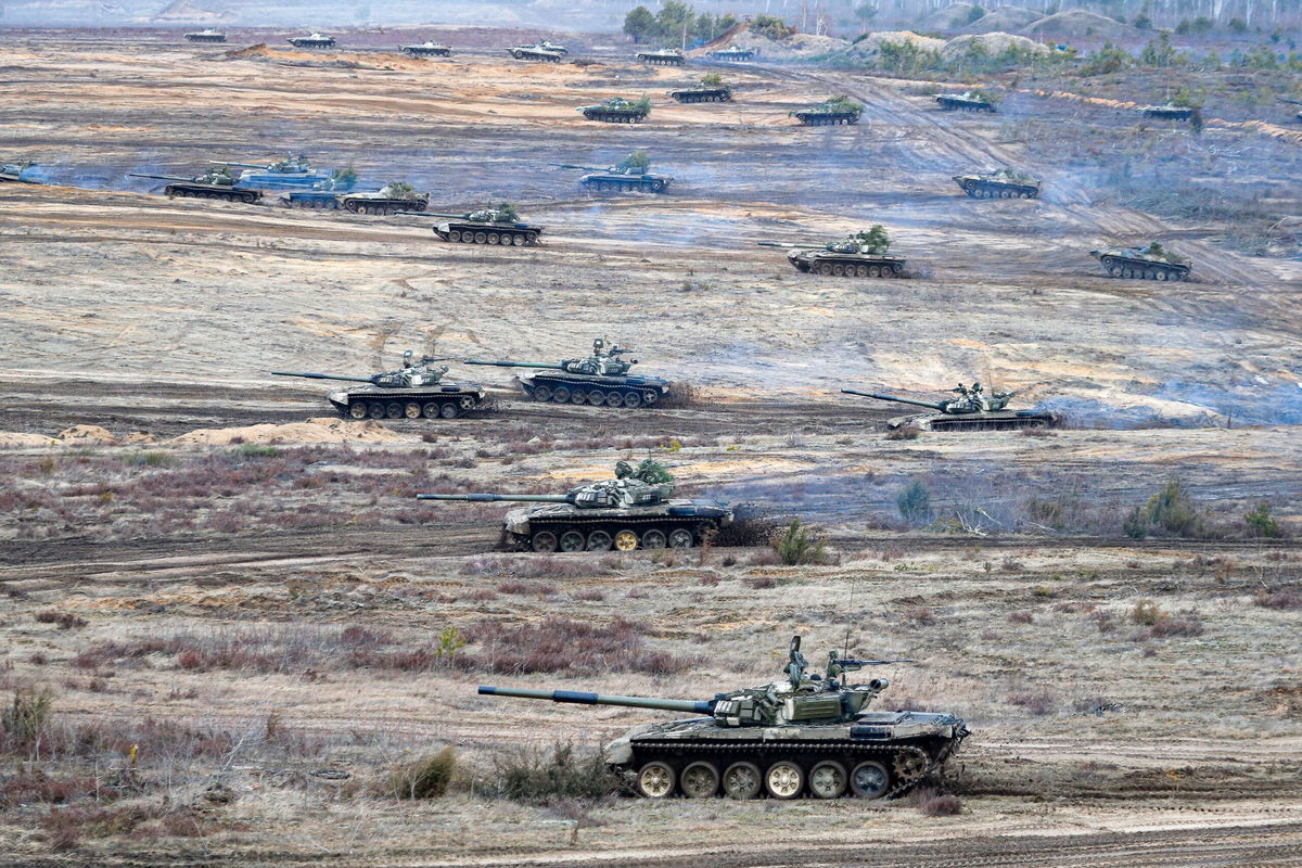 <i>Alexander Zemlianichenko Jr/AP</i><br/>Tanks move during the Union Courage-2022 Russia-Belarus military drills at the Obuz-Lesnovsky training ground in Belarus