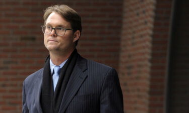 Mark Riddell leaves federal court in Boston in April 2019 after pleading guilty in the case. Riddell