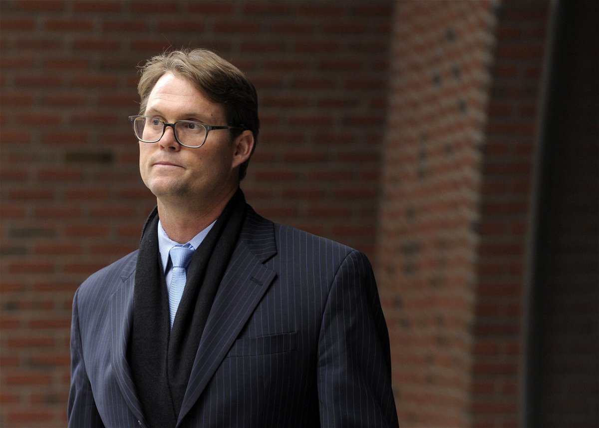 <i>Joseph Prezioso/AFP/Getty Images</i><br/>Mark Riddell leaves federal court in Boston in April 2019 after pleading guilty in the case. Riddell