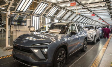 Employees make checks at an inspection line during a media tour of the Nio Inc. production facility in Hefei