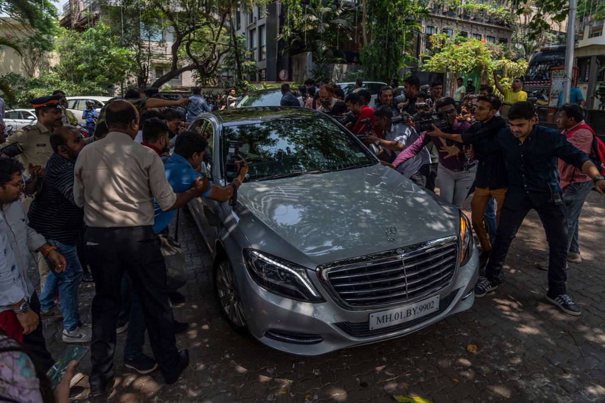 <i>Rafiq Maqbool/AP</i><br/>Members of the media jostle for photographs and footage of guests arriving to attend a function ahead of Kapoor and Bhatt's wedding.