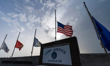 Flags are seen flying at half-staff at Camp Justice
