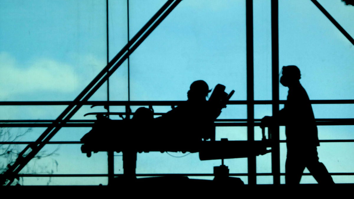 <i>Luiz C. Ribeiro/New York Daily News/Tribune News Service/Getty Images</i><br/>Hospital patients are seen being moved between wings at a New York hospital in February