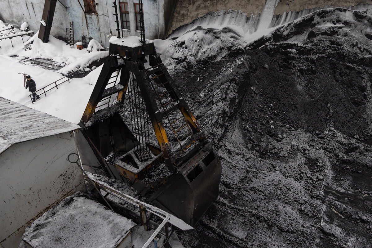 <i>Andrey Rudakov/Bloomberg/Getty Images</i><br/>A bucket loads coking coal from the yard at the Moscow coke and gas plant