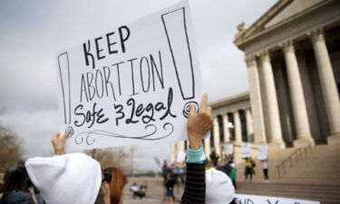 A person holds a sign during the Bans Off Oklahoma Rally on the steps on Oklahoma state Capitol in Oklahoma City