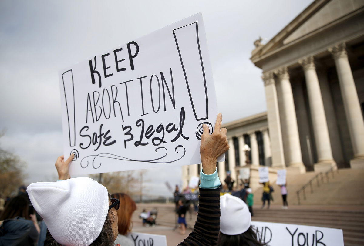 <i>Sarah Phipps/The Oklahoman/AP</i><br/>A person holds a sign during the Bans Off Oklahoma Rally on the steps on Oklahoma state Capitol in Oklahoma City