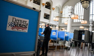 People vote in the primary election at a polling center on June 30