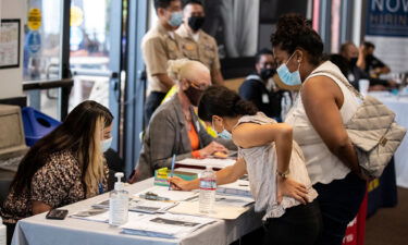 Job seekers interact with recruiters during a 'Back to Work' job fair organized by Goodwill in Los Angeles