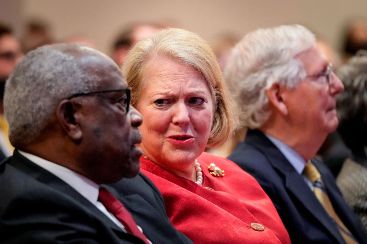 <i>Drew Angerer/Getty Images</i><br/>Associate Supreme Court Justice Clarence Thomas sits with his wife and conservative activist Virginia Thomas while he waits to speak at the Heritage Foundation on October 21