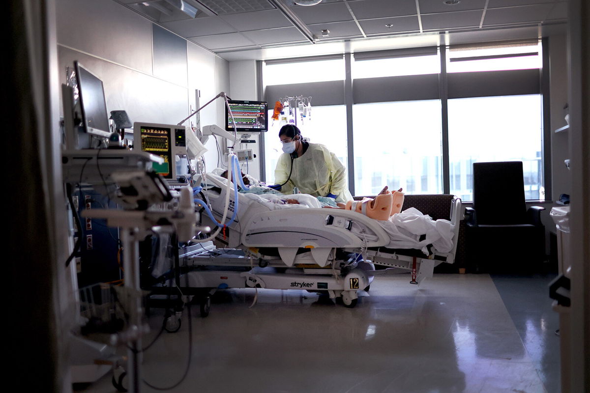 <i>Scott Olson/Getty Images</i><br/>Respiratory Therapist Nirali Patel works with a COVID-19 patient in the ICU at Rush University Medical Center on January 31 in Chicago.