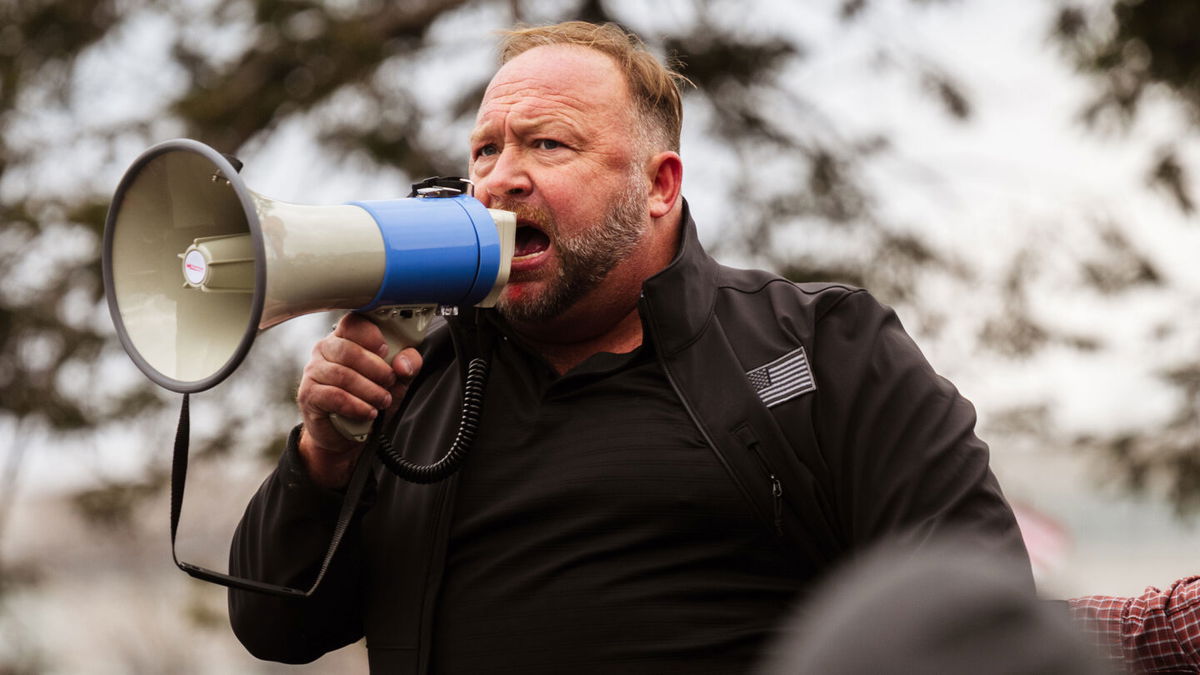 <i>Jon Cherry/Getty Images</i><br/>Infowars files for bankruptcy protection as founder Alex Jones faces defamation suits. Jones here addresses protesters after they stormed the Capitol Building on January 6