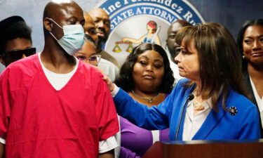 State Attorney Katherine Fernandez Rundle looks at Thomas Raynard James after announcing a motion to vacate his 1991 murder conviction on April 27