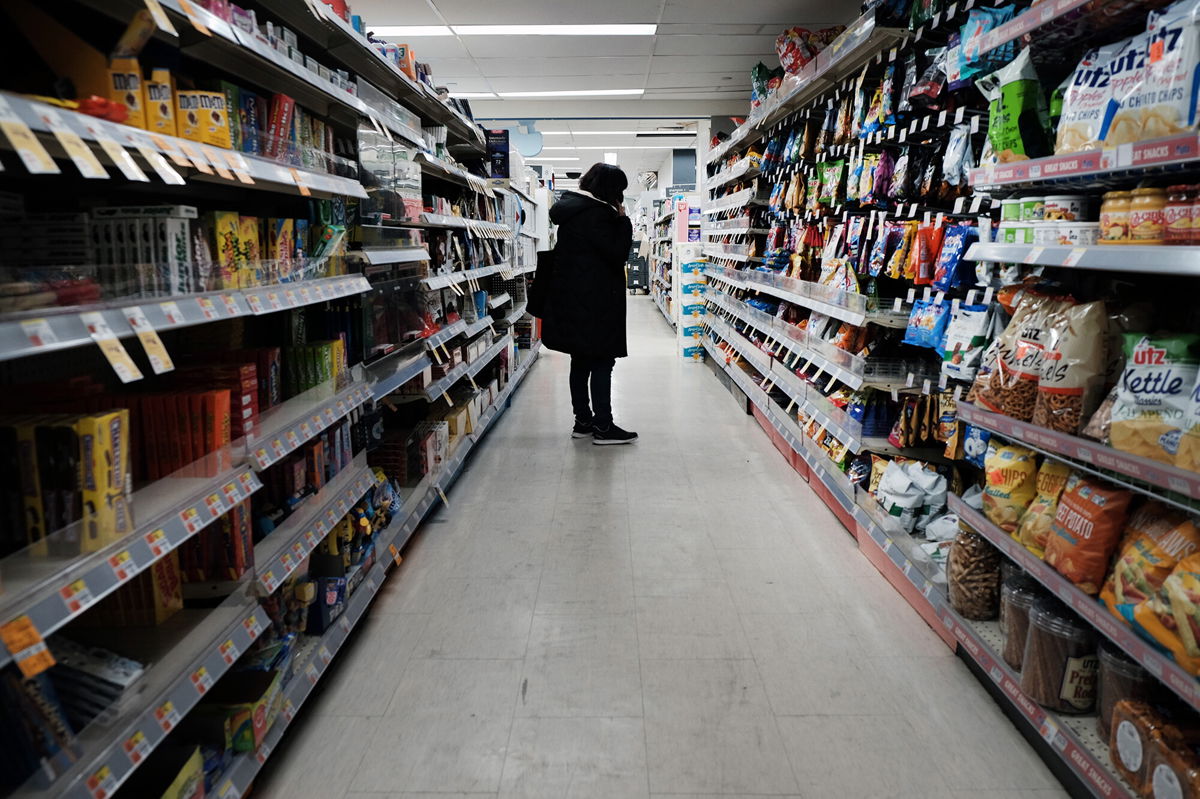 <i>Spencer Platt/Getty Images</i><br/>People shop in a store in Brooklyn on March 10