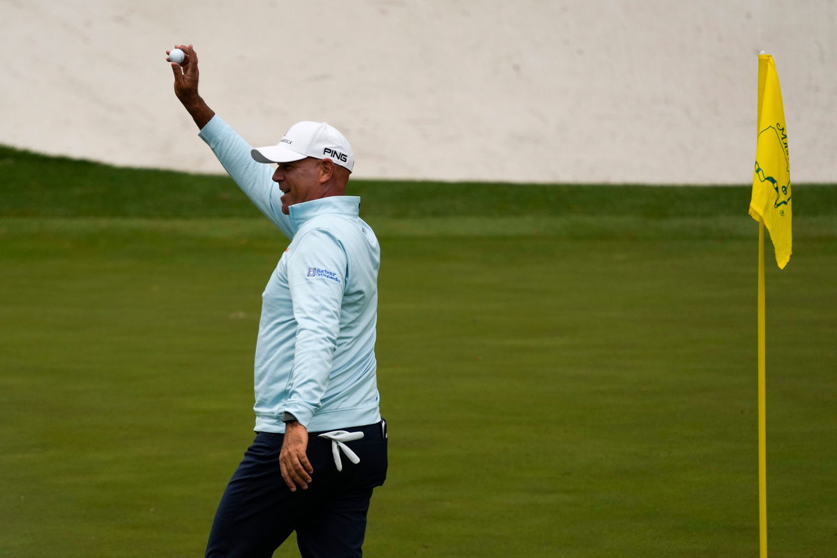 <i>Charlie Riedel/AP</i><br/>Cink holds up his ball after a hole-in-one on the 16th hole during the second round at the Masters.