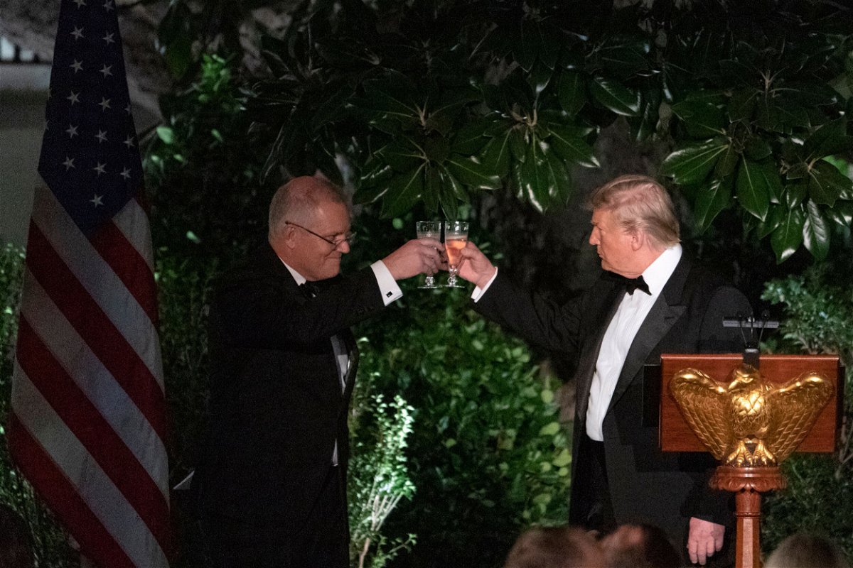 <i>ALEX EDELMAN/AFP/AFP/Getty Images</i><br/>Former US President Donald Trump and Australian Prime Minister Scott Morrison toast during a state dinner at the Rose Garden of the White House in Washington