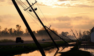 Downed power lines slump over a road in the aftermath of Hurricane Ida in Reserve