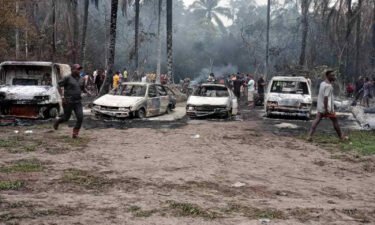 Damaged cars are seen following a blast at a Nigerian oil refinery on April 23