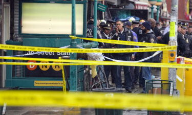 NYPD personnel gather at the entrance to a subway stop in Brooklyn on April 12. The suspect in the Brooklyn subway shooting was denied bail on April 14