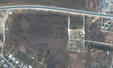 A satellite image from  March 23 shows a cemetery on edge of Manhush.