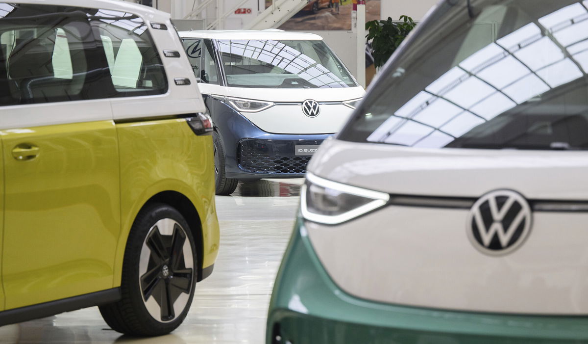 <i>Julian Stratenschulte/picture-alliance/dpa/AP Images</i><br/>Three models of the Volkswagen ID.Buzz electric bus are shown at the Volkswagen Commercial Vehicles plant on April 2022 in Lower Saxony