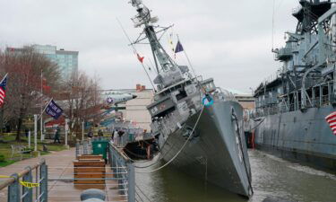 USS The Sullivans is tilting to one side after taking on water.