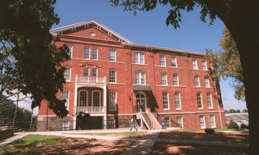 Morris Brown College students walk past the historic Gaines Hall on the campus in Atlanta on Thursday