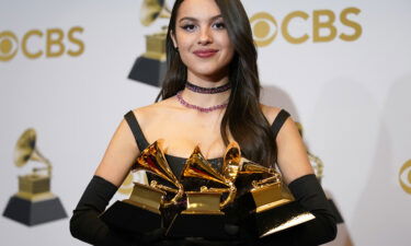 Olivia Rodrigo poses in the press room at the 64th Annual Grammy Awards on Sunday
