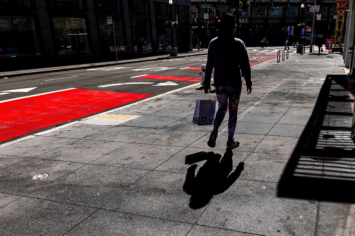 <i>David Paul Morris/Bloomberg/Getty Images</i><br/>A pedestrian carries a shopping bag in San Francisco