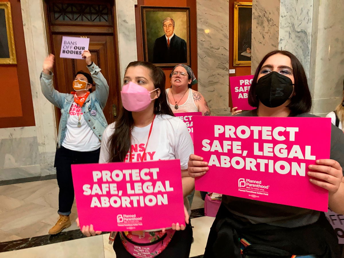 <i>Bruce Schreiner/AP</i><br/>Abortion-rights supporters chant their objections at the Kentucky Capitol on Wednesday in Frankfort.