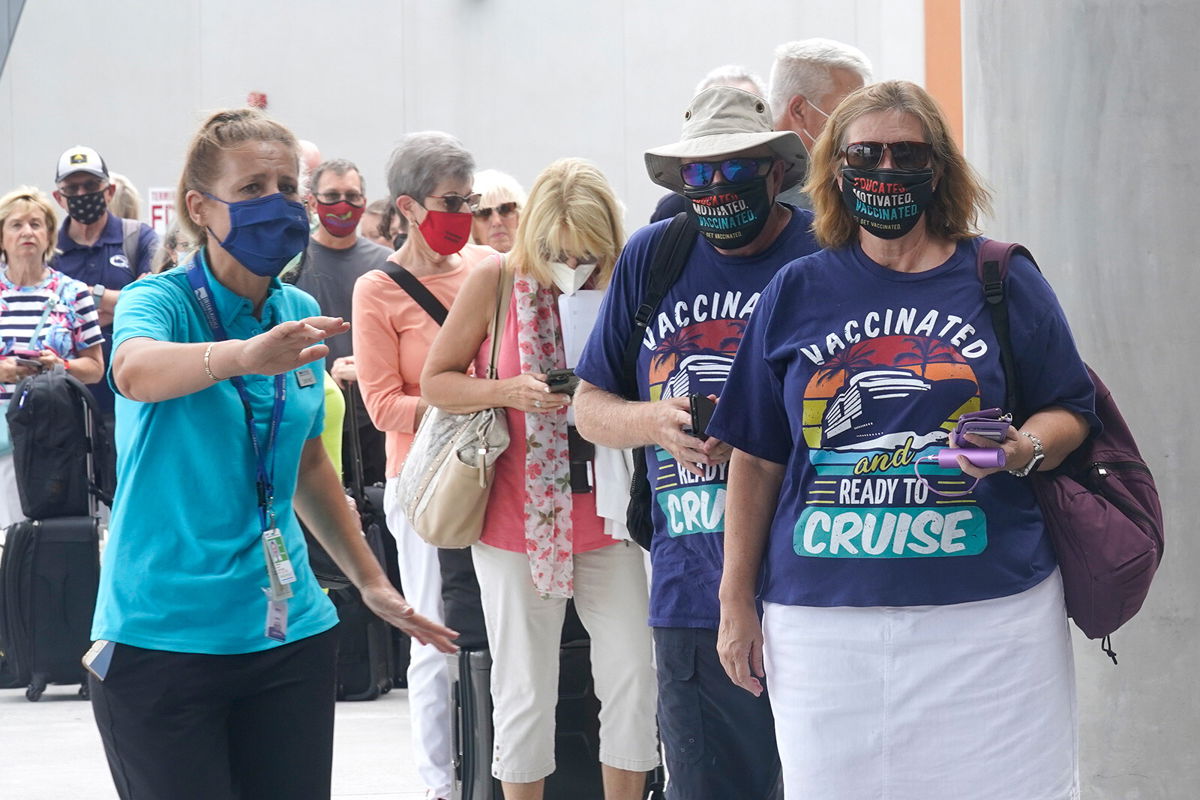 <i>Marta Lavandier/AP</i><br/>Passengers check into their cruise in Fort Lauderdale