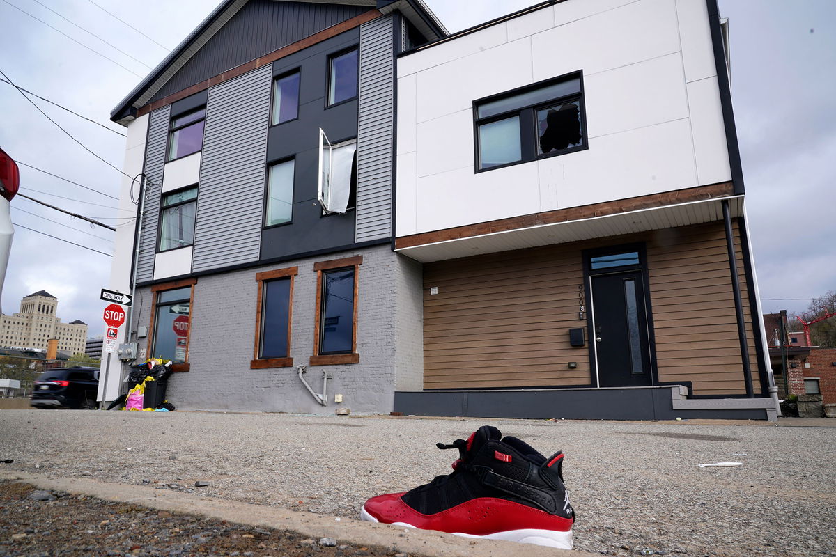 <i>Gene J. Puskar/AP</i><br/>A lone sneaker lies near the scene where police say a shooting took place in Pittsburgh early Sunday morning.