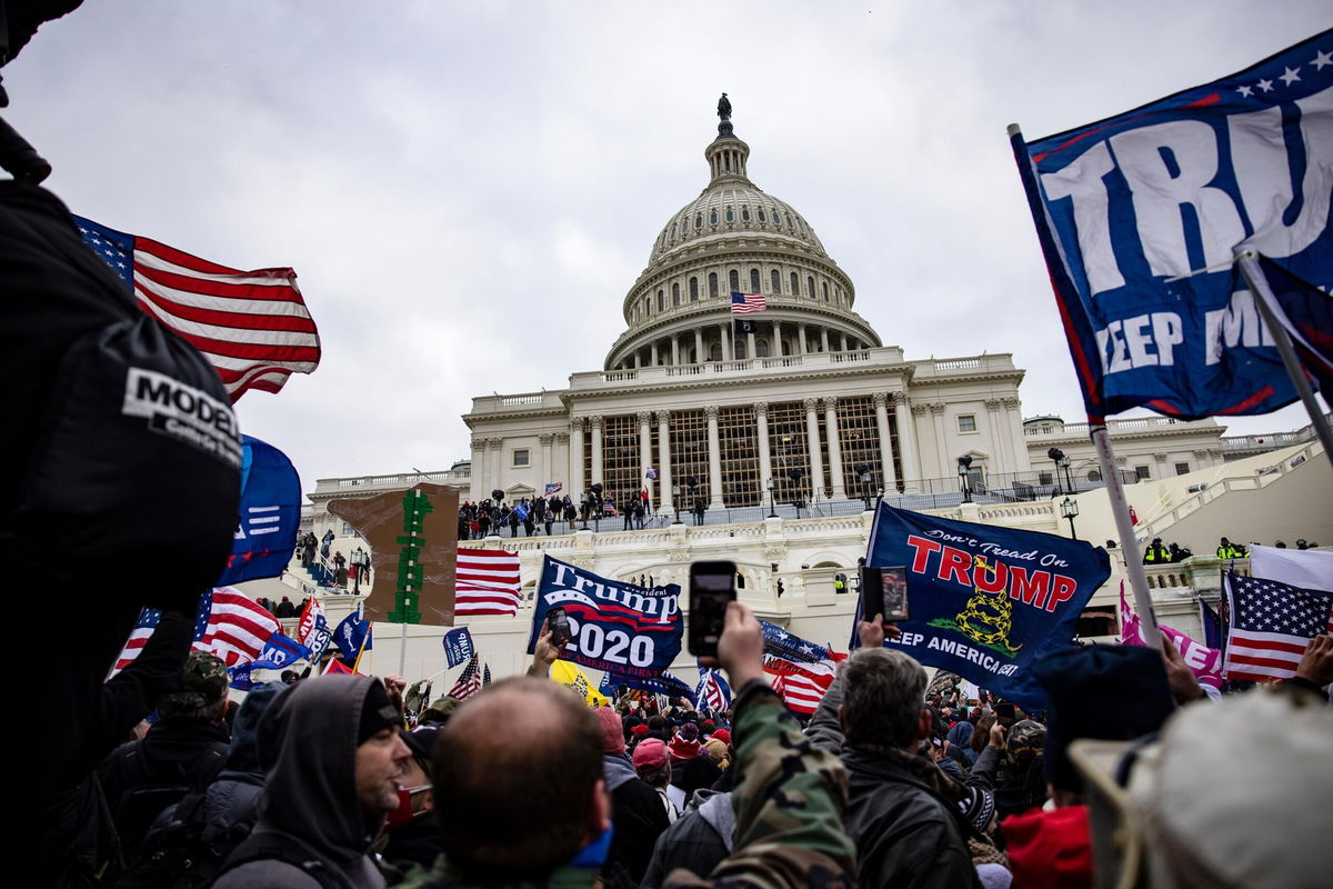 <i>Samuel Corum/Getty Images</i><br/>Pro-Trump supporters storm the U.S. Capitol following a rally with President Donald Trump on January 6