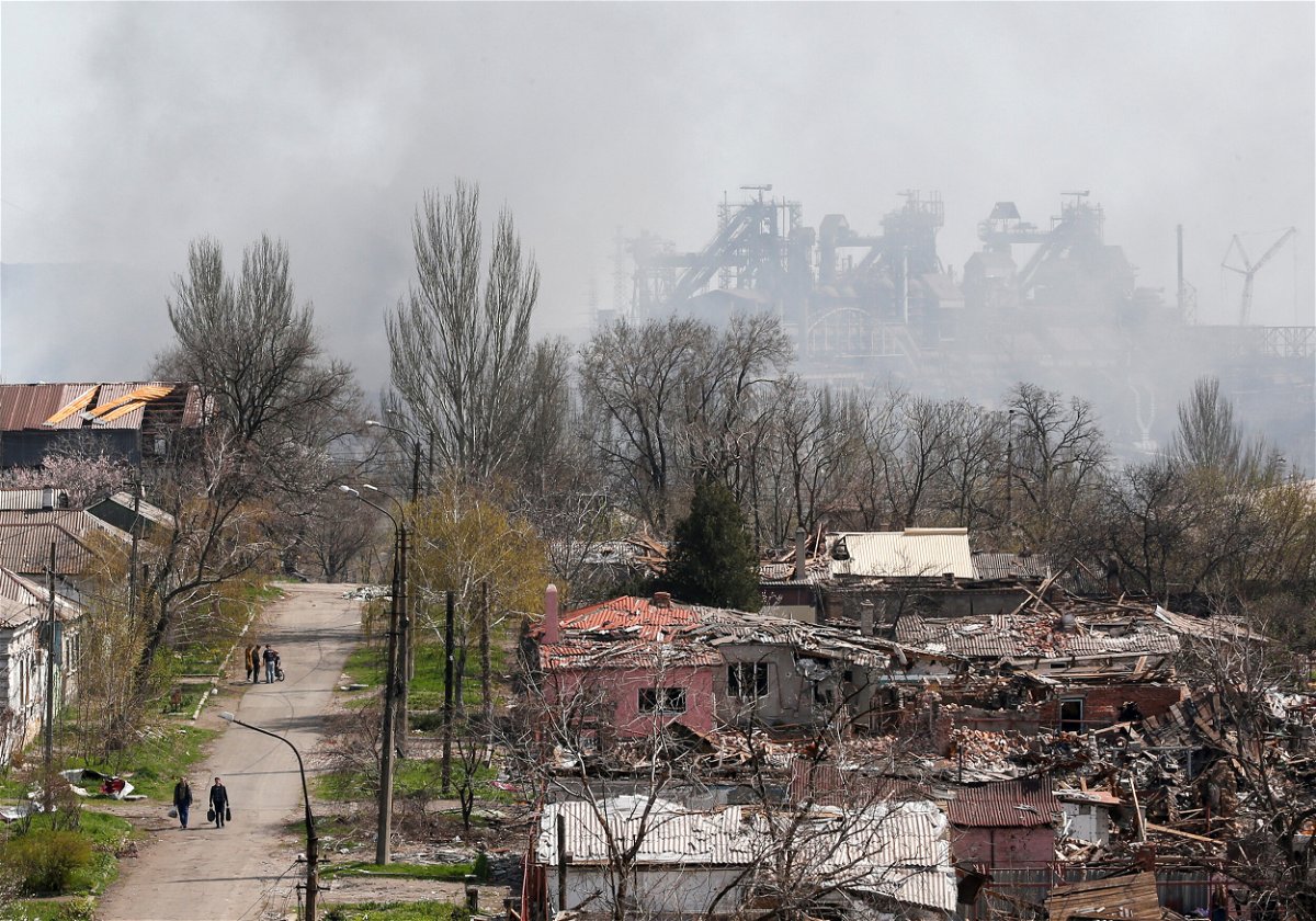 <i>Alexander Ermochenko/Reuters</i><br/>Smoke rises above the Azovstal plant as nearby buildings were flattened to the ground in Mariupol on April 18.