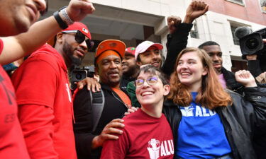 Union organizer Christian Smalls (L) celebrates following the April 1 vote for the unionization of the Amazon Staten Island warehouse in New York.