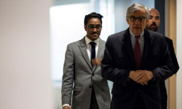 Stop the Steal organizer Ali Alexander (left) returns to a conference room for a deposition meeting on Capitol Hill with the House select committee investigating the January 6 attack on December 9