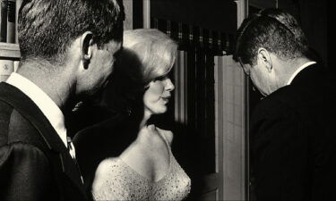 Marilyn Monroe with Robert Kennedy (left) and John Kennedy the night of the latter's birthday celebration in 1962.